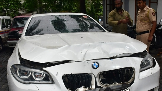 Worli hit and run case BMW car standing at premises of worli police station and police official inspecting car at parking stand of worli police station, at Worli, in Mumbai, India, on Sunday, July 07, 2024. (Photo by Bhushan Koyande/HT Photo)