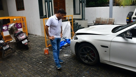 Mumbai, India – July 07, 2024: Worli hit and run case BMW car standing at premises of worli police station and police official inspecting car at parking stand of worli police station, at Worli, in Mumbai, India, on Sunday, July 07, 2024. (Photo by Bhushan Koyande/HT Photo)