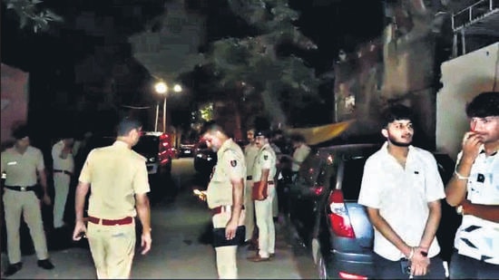 Chandigarh Police at the crime scene following the violent attack at 2 am on Monday. The victim remains critical at GMCH-32. (HT Photo)