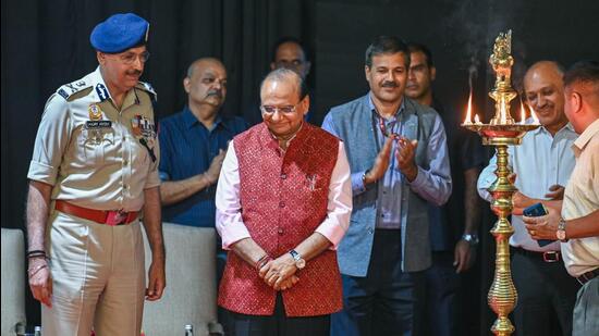 Delhi LG VK Saxena, Sanjay Arora (Commissioner of Delhi Police), Naresh Kumar (Delhi chief secretary), and Ashwani Kumar (MCD commissioner) at the launch of the public amusement portal at NDMC Convention Centre in New Delhi on Monday. (Raj K Raj/HT Photo)