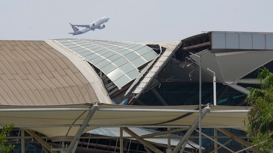 A plane takes off from the Indira Gandhi International Airport where a canopy collapsed on vehicles parked at Terminal- 1 amid heavy rain, in New Delhi, Friday. (HT_PRINT)