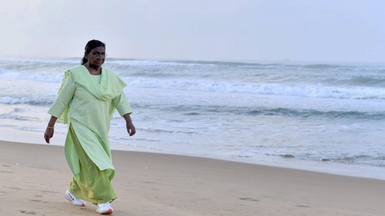 President Droupadi Murmu takes a stroll at Puri beach, Monday, July 8, 2024. (PTI Photo)(PTI)