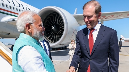 Prime Minister Narendra Modi was received by first deputy prime minister of Russia, Denis Manturov upon his arrival at the airport in Moscow on July 8(X/@narendramodi/PTI)