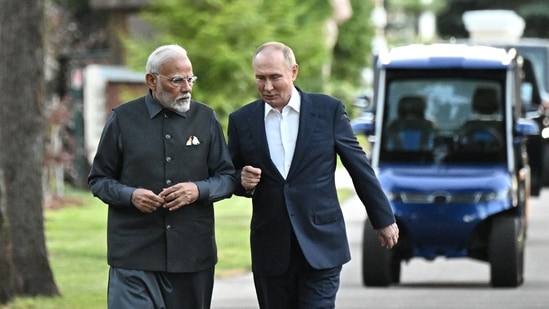 Prime Minister Narendra Modi and Russia's President Vladimir Putin walk during their meeting at the Novo-Ogaryovo state residence near Moscow, Russia July 8, 2024.(Reuters)