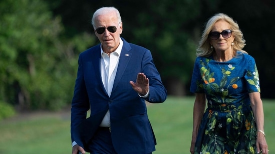 TOPSHOT - US President Joe Biden and First lady Jill Biden walk to the White House in Washington, DC, on July 7, 2024, as they return after attending campaign events in Pennsylvania.