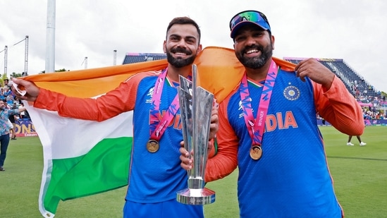 India's Captain Rohit Sharma and Virat Kohli with the ICC Mens T20 World Cup 2024 trophy, at Kensington Oval in Barbados.(ANI)