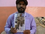 In this photo taken on February 22, 2024, Mohammed Imran shows his brother Mohammed Asfan image who was stranded in Russia along the war torn Ukraine border, at their home in Hyderabad. An apple farmer, an airline caterer and an out-of-work graduate are among the Indian nationals hired by Moscow, with the help of recruiters around the world, for the Russian Army in Ukraine.