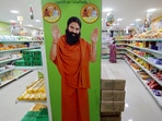 A hoarding with an image of Baba Ramdev is seen inside a Patanjali store in Ahmedabad, India.(Reuters)