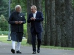 Russia's President Vladimir Putin and India's Prime Minister Narendra Modi walk during their meeting at the Novo-Ogaryovo state residence near Moscow (Reuters)