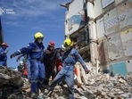 Rescuers carry the body of a person found under debris at the site where an apartment building was hit by a Russian missile strike, amid Russia's attack on Ukraine, in Kyiv, Ukraine July 9, 2024. Press service of the State Emergency Service of Ukraine(via REUTERS)