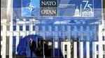 A Nato summit attendee walks through the Walter E Washington Convention Center in Washington, on Tuesday. (AP) A Nato summit attendee walks through the Walter E Washington Convention Center in Washington, on Tuesday. (AP)