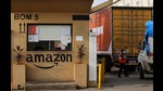 FILE PHOTO: A man inspects trucks before they enter an Amazon storage facility on the outskirts of Mumbai, India, October 1, 2021. Picture taken October 1, 2021. REUTERS/Francis Mascarenhas//File Photo (REUTERS) FILE PHOTO: A man inspects trucks before they enter an Amazon storage facility on the outskirts of Mumbai, India, October 1, 2021. Picture taken October 1, 2021. REUTERS/Francis Mascarenhas//File Photo (REUTERS)