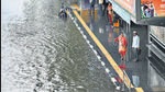 People (above) walk amid rain at Kartavya Path on Tuesday; Commuters at a waterlogged bus top at ITO. (Raj K Raj/Arvind Yadav/HT) People (above) walk amid rain at Kartavya Path on Tuesday; Commuters at a waterlogged bus top at ITO. (Raj K Raj/Arvind Yadav/HT)