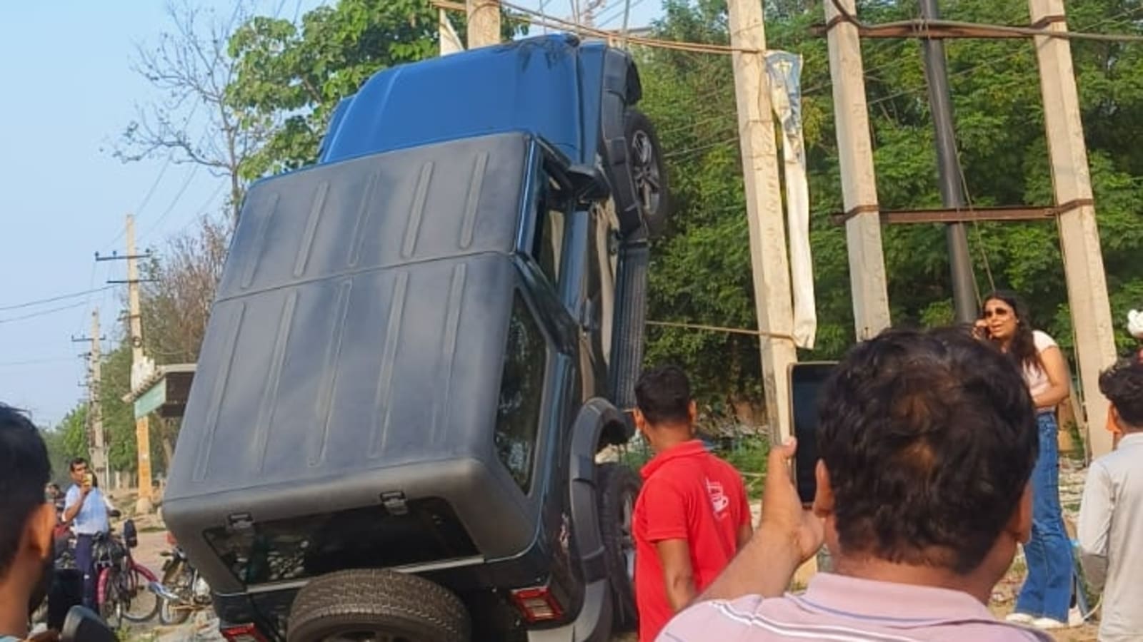 Thar SUV hit by speeding Honda Amaze, goes up electric pole on Gurugram