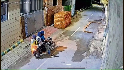 A CCTV grab of the three accused while opening fire at a house. (HT Photo) A CCTV grab of the three accused while opening fire at a house. (HT Photo)