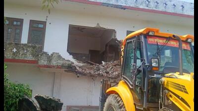 A portion of SP leader Azam Khan’s resort being razed in Rampur on July 9. (HT photo)