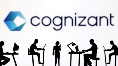 Figurines with computers and smartphones are seen in front of Cognizant's logo. (Reuters)