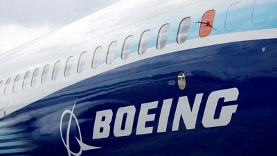 FILE PHOTO: The Boeing logo is seen on the side of a Boeing 737 MAX at the Farnborough International Airshow, in Farnborough, Britain, July 20, 2022.  REUTERS/Peter Cziborra/File Photo (REUTERS)