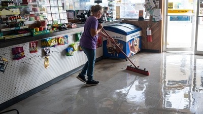 A worker sweeps water from a damaged convenience store after Hurricane Beryl made landfall in Palacios, Texas, US. (Bloomberg) A worker sweeps water from a damaged convenience store after Hurricane Beryl made landfall in Palacios, Texas, US. (Bloomberg)