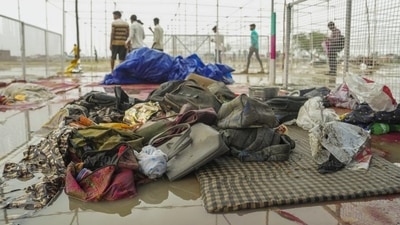 Bags and other belongings lying at the scene a day after a massive stampede that took place during a 'satsang' (religious congregation), in Sikandara Rao area in Hathras district on July 2. (PTI file) Bags and other belongings lying at the scene a day after a massive stampede that took place during a 'satsang' (religious congregation), in Sikandara Rao area in Hathras district on July 2. (PTI file)