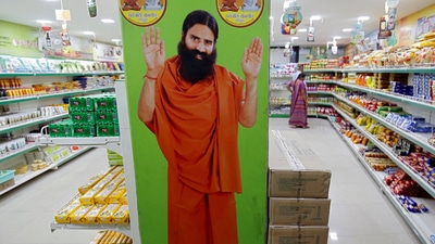 A hoarding with an image of Baba Ramdev is seen inside a Patanjali store in Ahmedabad, India. (Reuters)