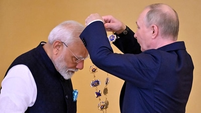 Russian President Vladimir Putin decorates Indian Prime Minister Narendra Modi with the Order of St. Andrew the Apostle the First-Called during a ceremony following their talks at the Kremlin in Moscow on July 9, 2024. (Photo by Alexander NEMENOV / AFP) Russian President Vladimir Putin decorates Indian Prime Minister Narendra Modi with the Order of St. Andrew the Apostle the First-Called during a ceremony following their talks at the Kremlin in Moscow on July 9, 2024. (Photo by Alexander NEMENOV / AFP)