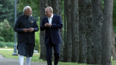 Russia's President Vladimir Putin and India's Prime Minister Narendra Modi walk during their meeting at the Novo-Ogaryovo state residence near Moscow (Reuters) (via REUTERS)
