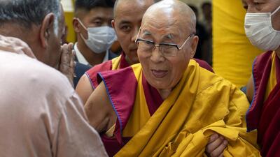 Tibetan spiritual leader the Dalai Lama greets a guest as he leaves after attending a special event during which Tibetans made him traditional offerings and prayed for his long life at the Tsuglakhang temple in Dharamshala (AP FILE PHOTO) Tibetan spiritual leader the Dalai Lama greets a guest as he leaves after attending a special event during which Tibetans made him traditional offerings and prayed for his long life at the Tsuglakhang temple in Dharamshala (AP FILE PHOTO)