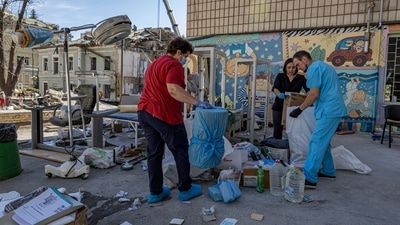 Workers try to salvage intact medical equipment in the hospital yard at the site of Okhmatdyt children's hospital hit by Russian missiles on Monday, in Kyiv, Ukraine, Tuesday, July 9, 2024. (AP) Workers try to salvage intact medical equipment in the hospital yard at the site of Okhmatdyt children's hospital hit by Russian missiles on Monday, in Kyiv, Ukraine, Tuesday, July 9, 2024. (AP)