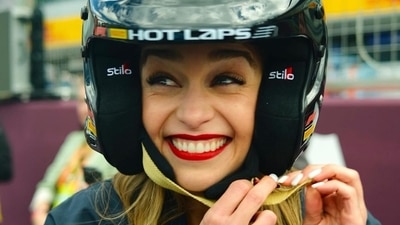 Emilia Clarke also tried on the F1 helmet and flashed a big smile for the paparazzi. 