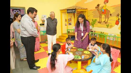 Chandigarh administrator Banwarilal Purohit at the anganwadi centre in Dadumajra on Tuesday. (HT Photo)