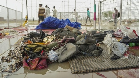 Bags and other belongings lying at the scene a day after a massive stampede that took place during a 'satsang' (religious congregation), in Sikandara Rao area in Hathras district on July 2.(PTI file)