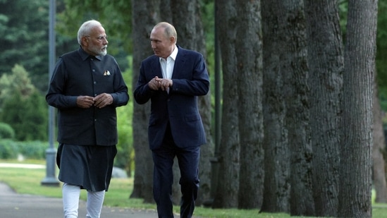 Russia's President Vladimir Putin and India's Prime Minister Narendra Modi walk during their meeting at the Novo-Ogaryovo state residence near Moscow (Reuters)(via REUTERS)