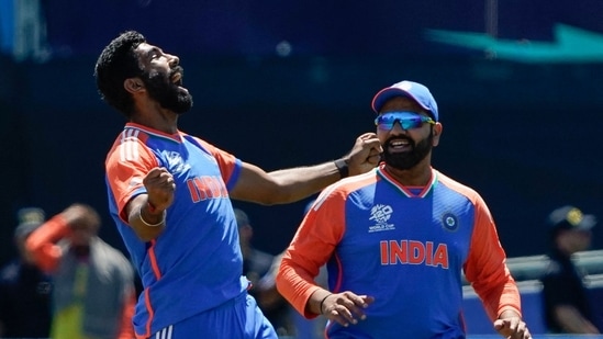 India's Jasprit Bumrah celebrates with teammate Rohit Sharma after Pakistan's Azam Khan was dismissed during the ICC men's Twenty20 World Cup 2024 group A cricket match between India and Pakistan (AFP)