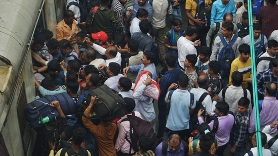 Thane, India - July 08, 2024: Due to heavy rains in Thane district, local services have been affected and as local trains are running late, there is a rush of commuters at Thane station on Monday morning , in Thane,in Mumbai, India, on, Monday, July 08, 2024. ( Praful Gangurde / HT Photo )