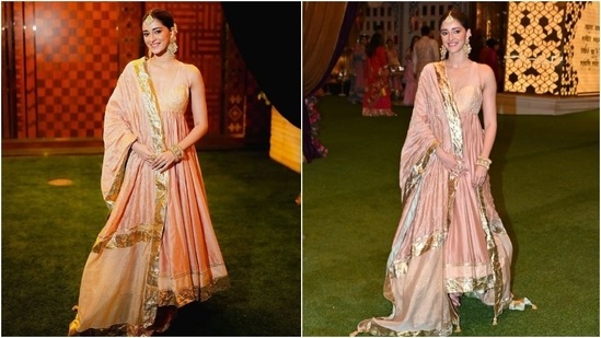 Ananya Panday wore a blush pink anarkali suit set to Ambani's Haldi ceremony. She wore a sleeveless anarkali kurta, a matching dupatta, and churidar pyjamas. A mang tika, chandbalis, kadhas, rings, gajra-adorned bun, and striking glam rounded off the styling.&nbsp;(HT Photo/Varinder Chawla)