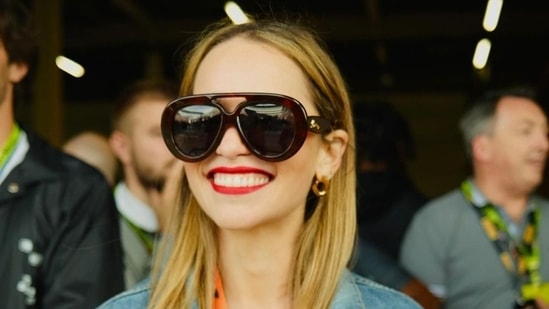 Game of Thrones star Emilia Clarke flashed a big smile as she made a surprise appearance at the F1 British Grand Prix.&nbsp;