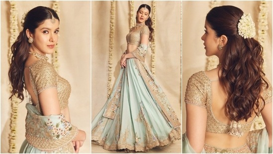 Shanaya Kapoor dazzled at the Haldi ceremony in a gold and ice blue lehenga set designed by Anamika Khanna. The brocade embroidered blouse complements the ice-blue lehenga skirt adorned with gold kadhai work, sequins, and floral patterns. The matching dupatta - draped on Shanaya's arms - completed the ensemble. (Instagram)