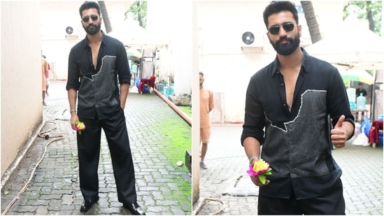 Vicky Kaushal promoted Bad Newz in Mumbai today, dressed in a sophisticated all-black look. He wore a printed button-down shirt, flared pants, dress shoes, sunglasses, a trimmed beard, and a backswept hairdo.&nbsp;(HT Photo/Varinder Chawla)