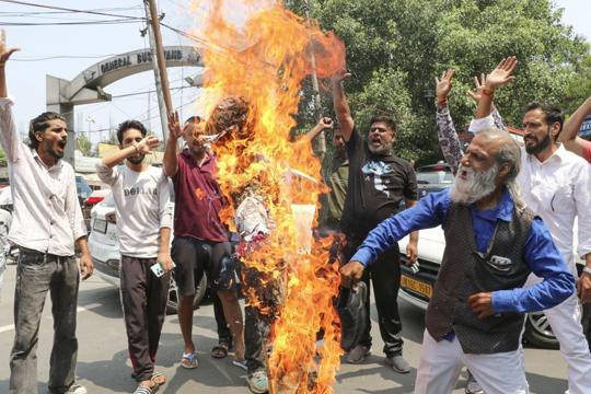 People stage a protest in Jammu following the terrorist attack on an army convoy in Kathua on Tuesday. (PTI Photo) People stage a protest in Jammu following the terrorist attack on an army convoy in Kathua on Tuesday. (PTI Photo)