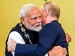 Prime Minister Narendra Modi embraces Russian President Vladimir Putin (ANI)