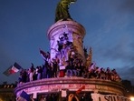 Participants wave French national tricolors during an election night rally following the first results of the second round of France's legislative election at Place de la Republique in Paris on July 7, 2024. (Photo by Emmanuel Dunand / AFP) Participants wave French national tricolors during an election night rally following the first results of the second round of France's legislative election at Place de la Republique in Paris on July 7, 2024. (Photo by Emmanuel Dunand / AFP)