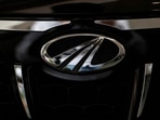 Mahindra & Mahindra share price: The logo of Mahindra and Mahindra is seen on a car at a showroom in Mumbai, India.