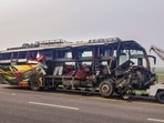 Mangled remains of a bus being towed after an accident, in Unnao district. (PTI) Mangled remains of a bus being towed after an accident, in Unnao district. (PTI)