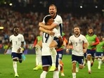 England's Harry Kane celebrates with Ollie Watkins after winning the match.