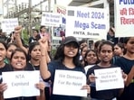 Students holding placards protest against the alleged irregularities in the NEET examination, in Bhopal. (ANI) Students holding placards protest against the alleged irregularities in the NEET examination, in Bhopal. (ANI)