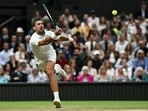 Serbia's Novak Djokovic returns the ball to Denmark's Holger Rune during their men's singles tennis match on the eighth day of the 2024 Wimbledon Championships Serbia's Novak Djokovic returns the ball to Denmark's Holger Rune during their men's singles tennis match on the eighth day of the 2024 Wimbledon Championships