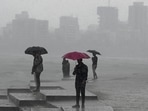 TOPSHOT - People enjoy rain showers near the sea front in Mumbai on July 8, 2024. (Photo by Punit PARANJPE / AFP)(AFP) TOPSHOT - People enjoy rain showers near the sea front in Mumbai on July 8, 2024. (Photo by Punit PARANJPE / AFP)(AFP)
