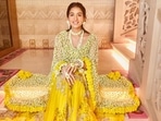 Filmmaker-stylist Rhea Kapoor shared pictures of the dulhan’s canary yellow embroidered lehenga by designer Anamika Khanna