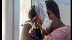 Dilshad, who was a co-passenger in the bus, grieves while talking on the mobile phone as he arrives at the district hospital to identify bodies of 6 members of his family after a collision between a tanker and a bus, in Unnao district, Wednesday. (PTI Photo) Dilshad, who was a co-passenger in the bus, grieves while talking on the mobile phone as he arrives at the district hospital to identify bodies of 6 members of his family after a collision between a tanker and a bus, in Unnao district, Wednesday. (PTI Photo)